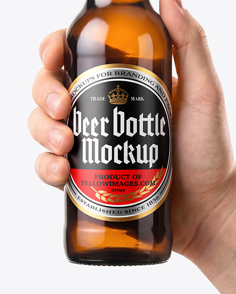 Amber Glass Beer Bottle in a Hand Mockup