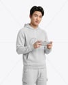 Asian Man Wearing Hoodie with Portable Console Mockup