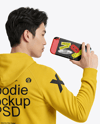 Asian Man Wearing Hoodie with Portable Console Mockup