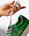 Woman's Hands Holding Sneaker Mockup