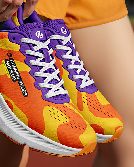 Pair of Running Shoes in Woman's Hand Mockup