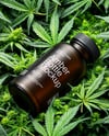 Amber Supplements Bottle on a Hemp Leaves Mockup