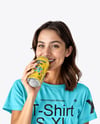 Woman Wearing a T-shirt Holding Drink Can Mockup