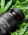 Amber Supplements Bottle on a Hemp Leaves Mockup