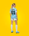 Female Soccer Player Wearing Jersey and Shorts Mockup