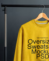 Sweatshirt on a Wooden Hanger Against a Plain Background Mockup
