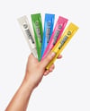 Five Sachets in a Hand Mockup