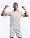 Man Wearing Soccer Jersey and Shorts Mockup