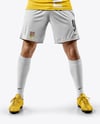 Man Wearing Soccer Jersey and Shorts Holds Cup Mockup