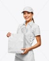 Female Fast Food Worker in Uniform with Paper Bag Mockup