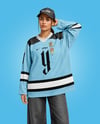 Woman Wearing Ice Hockey Jersey and Cap Mockup