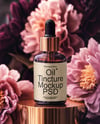 Amber Dropper Bottle with Oil Tincture Surrounded by Flowers Mockup