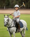 Boy Wearing Full Polo Kit on Horse Mockup