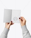Brochure in a Hand Mockup