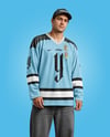 Man Wearing Ice Hockey Jersey and Cap Mockup