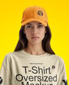 Young Woman Wearing T-Shirt and Baseball Cap Mockup