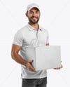Delivery Man Wearing Polo Shirt and Cap Holding Box Mockup