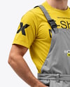 Builder Wearing Bib Overalls and T-Shirt Mockup
