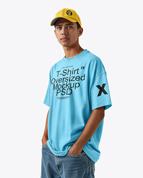 Young Man Wearing Oversized T-Shirt and Cap Mockup - Snapback cap psd mockup