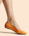Pair of Leather Ballet Flats on Woman's Legs Mockup