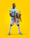 Soccer Player Wearing Jersey and Shorts Holds Cup Mockup