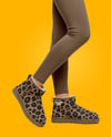 Pair of UGG Boots on Woman's Legs with Leggings Mockup