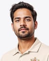 Indian Man Wearing Full Cricket Kit with Bat