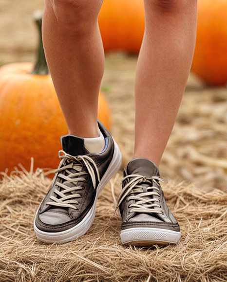 Young Woman in Sweatshirt Standing on Hay Block with Pumpkins Around Mockup
