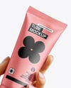 Cosmetic Tube in a Hand Mockup