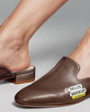 Pair of Leather Mules on Woman's Legs Mockup