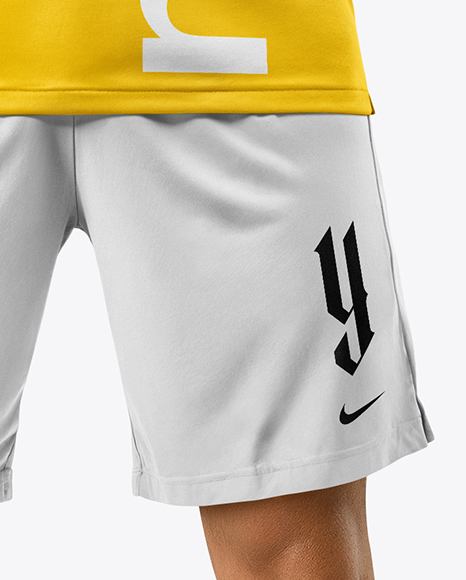 Man Wearing Soccer Jersey and Shorts Mockup