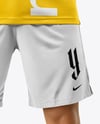 Man Wearing Soccer Jersey and Shorts Mockup