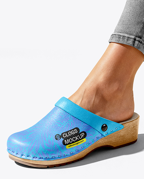 Pair of Clogs on Woman's Legs Sitting on Block Mockup