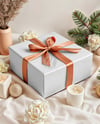 X-mas Gift Box with Bow and Decorations on Background Mockup