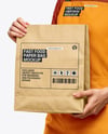 Female Fast Food Worker in Uniform with Paper Bag Mockup