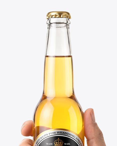 Clear Glass Beer Bottle in a Hand Mockup