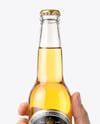Clear Glass Beer Bottle in a Hand Mockup