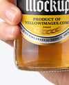 Clear Glass Beer Bottle in a Hand Mockup