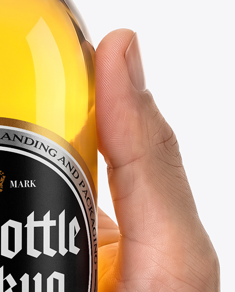 Clear Glass Beer Bottle in a Hand Mockup