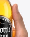 Clear Glass Beer Bottle in a Hand Mockup