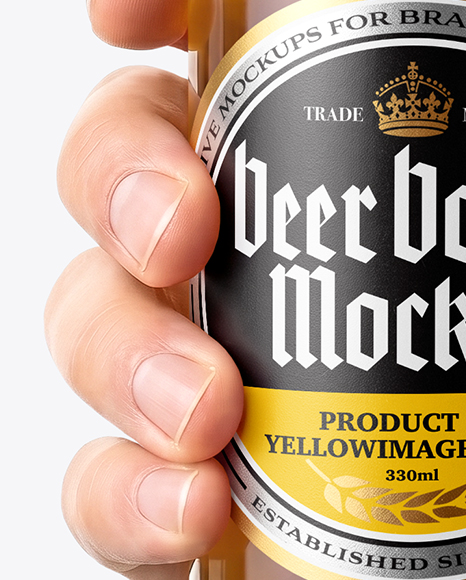 Clear Glass Beer Bottle in a Hand Mockup