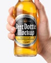 Clear Glass Beer Bottle in a Hand Mockup