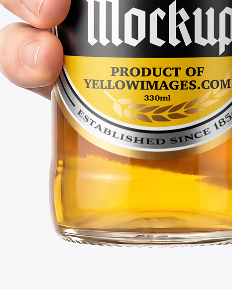 Clear Glass Beer Bottle in a Hand Mockup