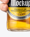 Clear Glass Beer Bottle in a Hand Mockup