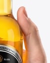 Clear Glass Beer Bottle in a Hand Mockup