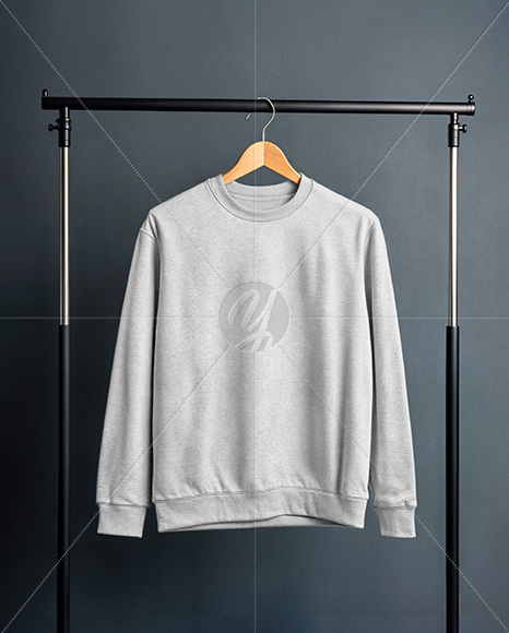 Sweatshirt on a Wooden Hanger Against a Plain Background Mockup