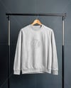 Sweatshirt on a Wooden Hanger Against a Plain Background Mockup