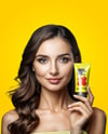 Woman Holding Glossy Cosmetic Tube in a Hand Mockup