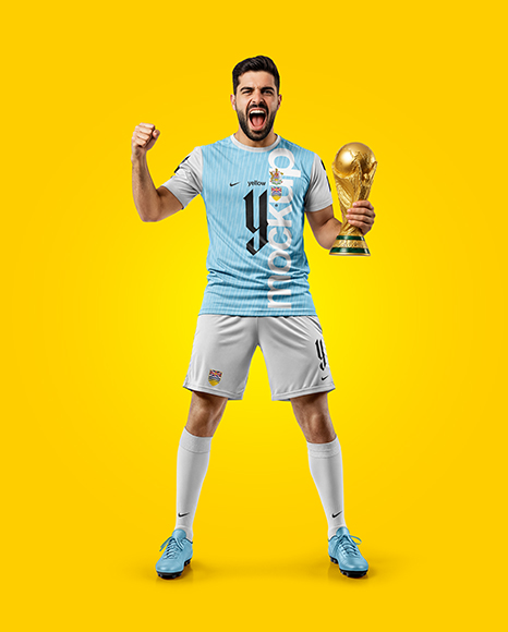 Man Wearing Soccer Jersey and Shorts Holds Cup Mockup
