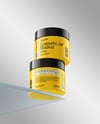 Two Glossy Cosmetic Jars on the Glass Mockup